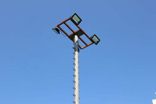 Low Angle View Of Floodlight Against Blue Sky