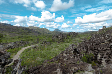 Beautiful mountain with vegetation and clouds in the sky. Broadleaf, Botumirim, Minas Gerais, Brazil.