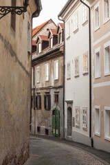 Studentovska ulica Street, an empty picturesque cobblestone medieval and narrow street by the Ljubljanski Hrad, Ljubljana castle in Slovenia with European medieval houses and trees. ..