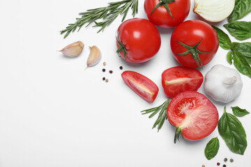 Composition with fresh basil leaves and tomatoes on white background, flat lay