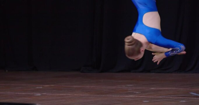 Beautiful performance of aerial gymnastics by two young girls on stage, 4k