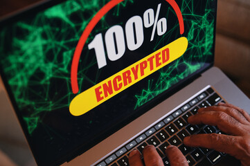 Ransomware encrypted laptop computer with hands on keyboard