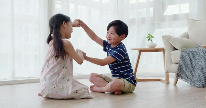 Happy sibling playing in living room,4K