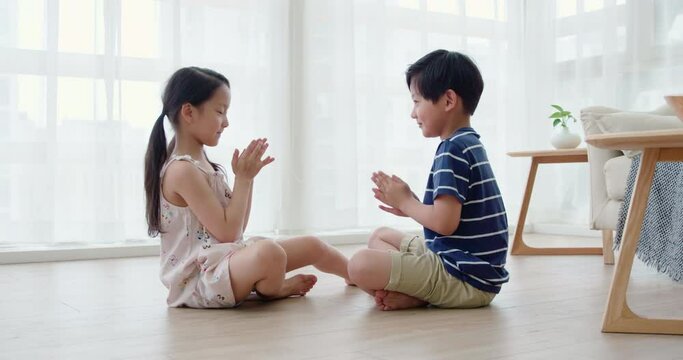 Happy sibling playing in living room,4K