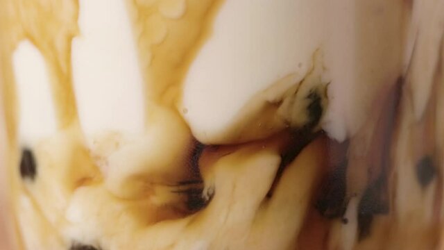 Macro Shot, Blending Pearl Milk Tea Process, with Tapioca Balls at the Bottom