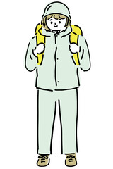 ヘルメットをかぶった避難する女性An evacuating woman wearing a helmet.