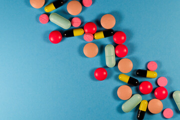 Pills And Capsules Diagonal Line On Blue Flat-lay