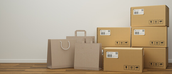 Shopping bags and cardboard boxes stacked on the wooden floor with white wall background