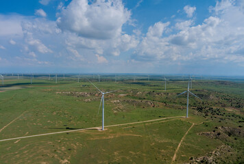 Fototapeta na wymiar Wind turbines windmill energy farm in West Texas