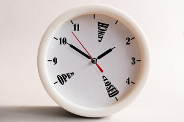 Sign design for a shop or office, opening and closing times in the form of a wall clock.