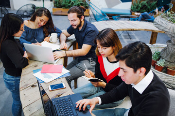 Group of young hispanic college students studying together at university in Mexico