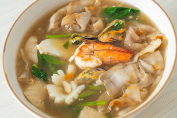 Wide Rice Noodles with Seafood in Gravy Sauce