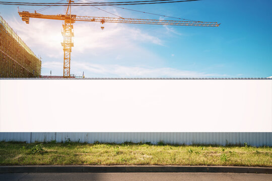 White blank hoarding poster with mockup space on construction site