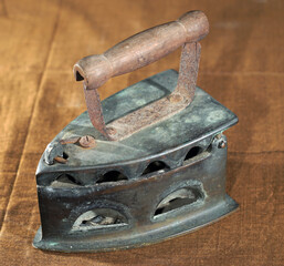 Traditional Iron with a wood handle