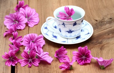 Herbal tea from fresh flowers of  Wild mallow, lat.  Malva sylvestris. Medicinal herb has been used in herbal medicine.  Good against cough and inflammation.
