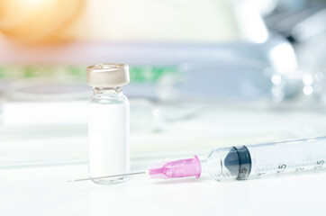 Vaccine COVID-19 . Syringe and blue vaccine vial, bottle of medicine. Coronavirus concept. Health illustration