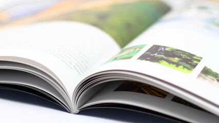 Opened magazine on a desk.
