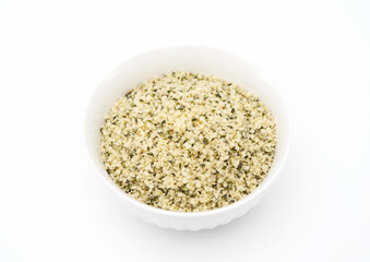 Organic shelled hemp seeds isolated on white background.