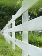 white fence on a green grass