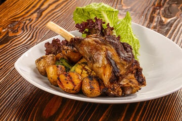 Baked lamb leg with vegetables