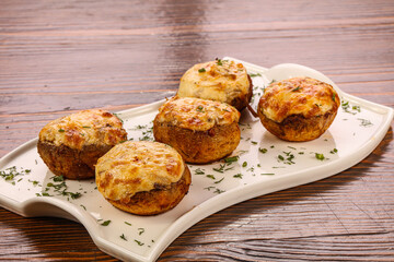 Baked champignon with cheese and herbs