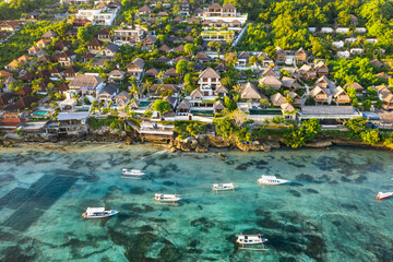 Aerial view of luxury villa and hotels on the Nusa Lembongan island coast facing the turquoise...