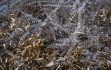 Background image of scrap brass and metal shavings for recycling 