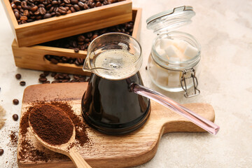 Turkish coffee in cezve on grunge background