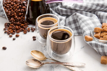 Cups of turkish coffee on light background