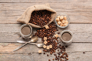 Cups of turkish coffee and beans on wooden background