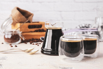 Cezve and cups of turkish coffee on table