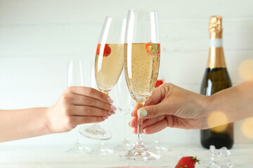 Female hands cheers with Rossini cocktails, close up