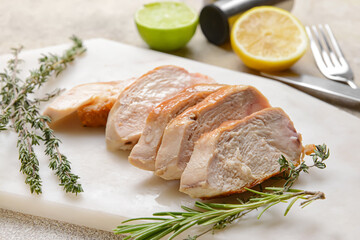 Tasty chicken fillet on light background
