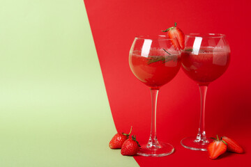 Alcoholic cocktail Rossini and ingredients on two tone background