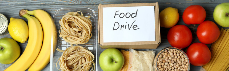 Concept of food drive with meal on wooden table