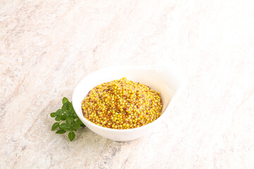 Grain mustard sauce in the bowl