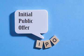 wood block with alphabet IPO - initial public offering and speech bubble