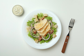 Concept of tasty eating with Caesar salad on white background