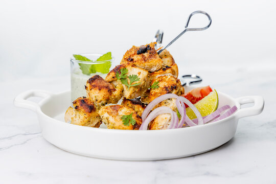 Chicken Tikka served on skewers