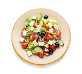 Plate with tasty Greek salad on white background
