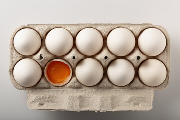 Fresh chicken eggs in a cardboard tray