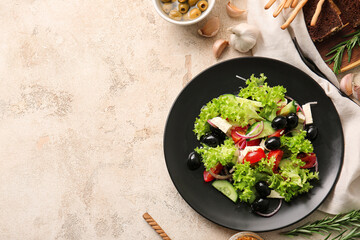 Plate with tasty Greek salad on grunge background