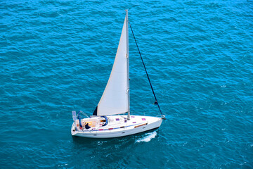 Beautifule white yacht in the blue sea. Top view.