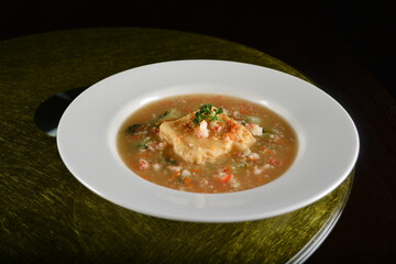 asian premium banquet menu braised homemade bean curd tofu in thick seafood gravy sauce on gold background dining table