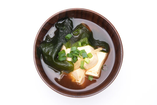 Japanese miso soup with tofu and seaweed wakame in a wooden bowl. Healthy food concept