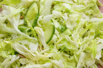 Tasty cabbage salad as background, closeup