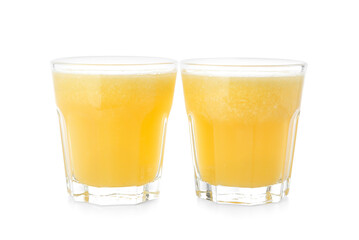 Glasses of tasty pineapple smoothie on white background