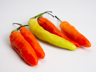 Close up shoot of red hot chillies on a white background