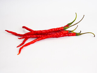 Close up shoot of red hot chillies on a white background