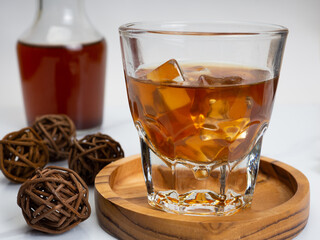 A cup of iced coffee on a wooden table